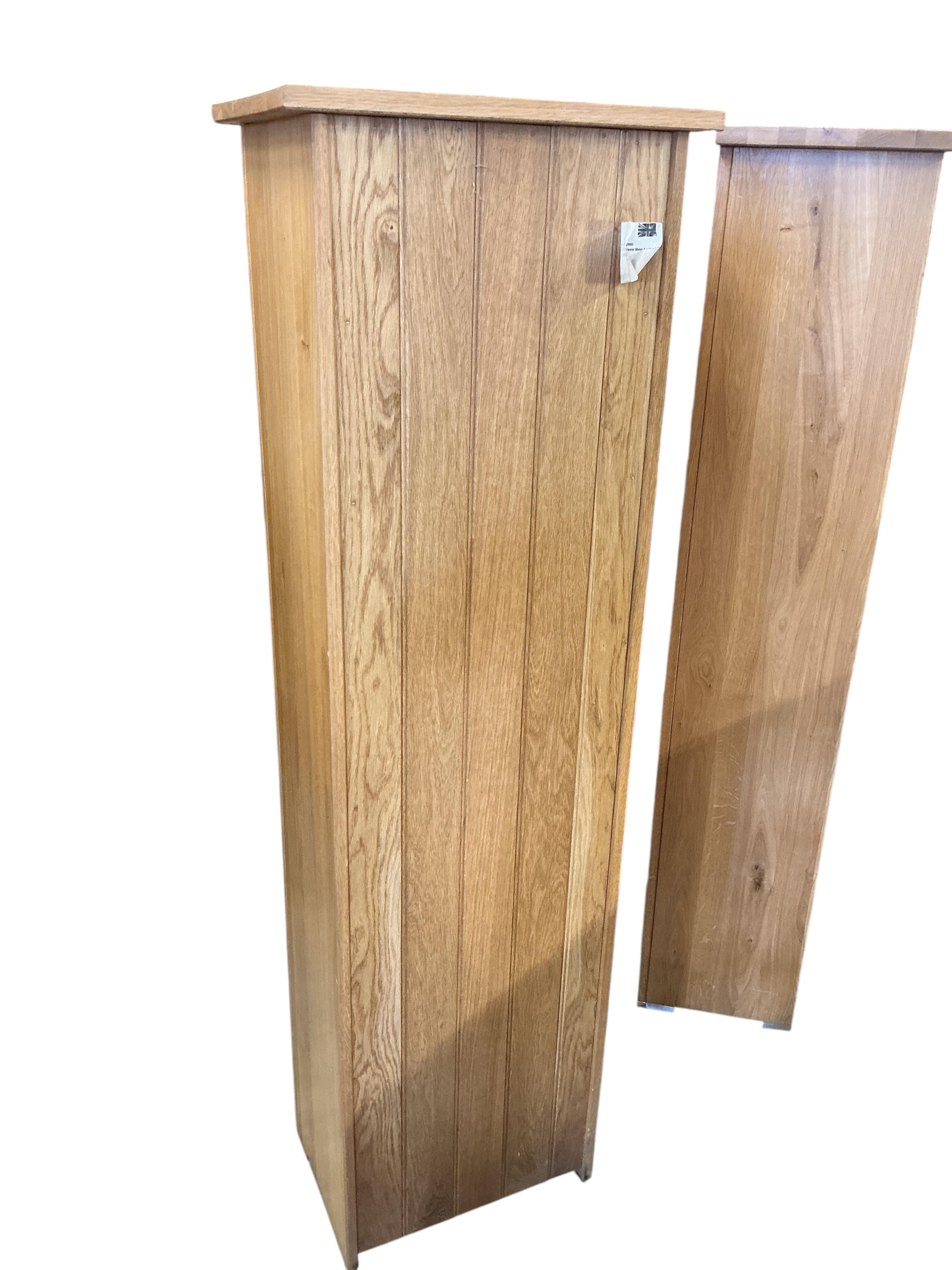 A set of three Contemporary light oak tall narrow chests of seven drawers, each width 52cm, depth 35cm, height 173cm
